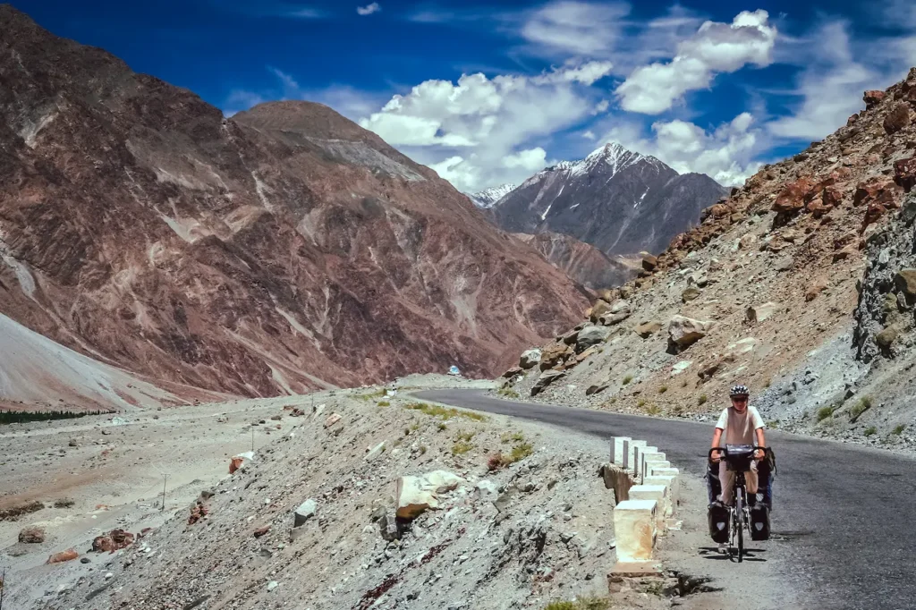 A Woman Cycling on Karakorum Highway