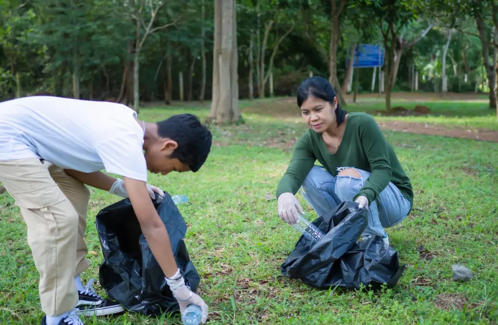 Young Volunteers are Taking Part in an Environmental Cleaning Activity in a Park